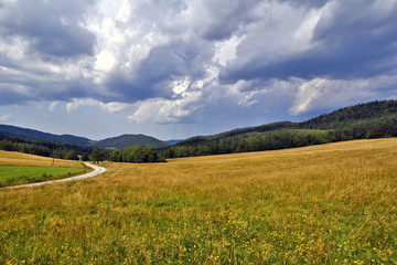 View  of Beskid Niski from Hutnianska pass, Poland  with dramatic sky - obrazy, fototapety, plakaty