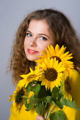 woman with sunflower flowers,