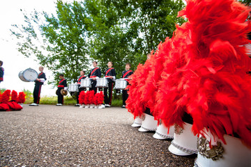 Details from a fanfare music, show and marching band. Playing musicians with wind and percussion...