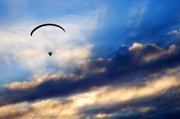 Paramotor Fly on Cloudy Sunset