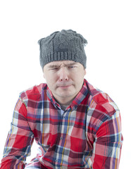 Caucasian man looking weird and funny with a hat on. The man isolated on white.