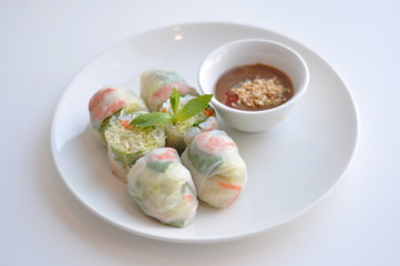 Fresh Spring Roll. A see-through rice paper rolled around pork & shrimp or tofu, lettuce, mint, steamed rice vermicelli. Served with Vietnamese peanut sauce
