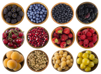 Black-blue, yellow and red berries isolated on white background. Cherry, strawberry, pomegranate, currant, raspberry, apricot, yellow plum, blackberry, bilberry; mulberry and blueberry. Top view