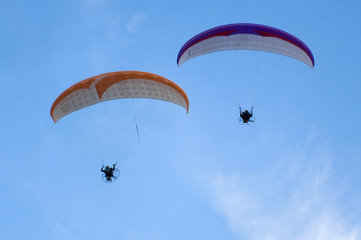 Paramotors in a Blue Sky