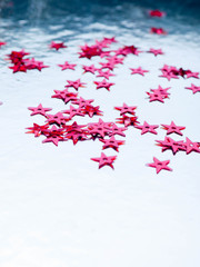 red stars confetti flying ower white background