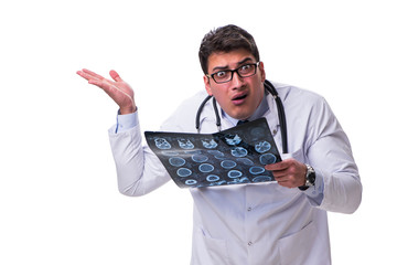 Young male doctor holding a radiograph isolated on white backgro