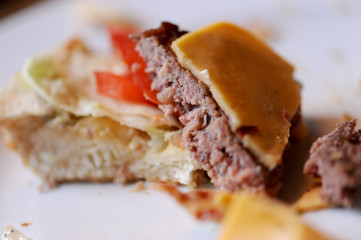 Messy food leftovers. Burger leftovers after party