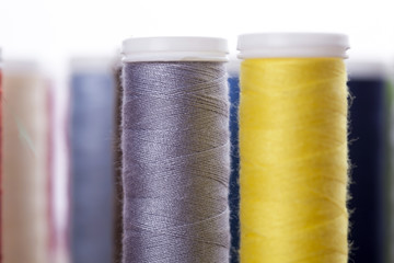 Sewing instruments, threads, needles, bobbins and materials.