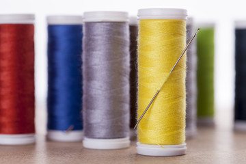 Sewing instruments, threads, needles, bobbins and materials.