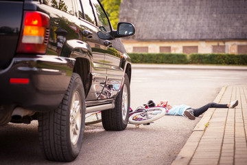 Accident. Girl on the bicycle crosses the road in front of a car © Room 76 Photography