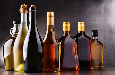 Fotobehang Bottles of assorted alcoholic beverages © monticellllo