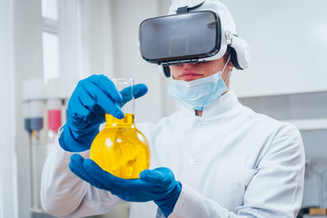Science technician in virtual reality glasses examines the drug in laboratory.