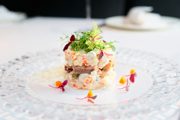 Russian salad cooked in modern way, toned