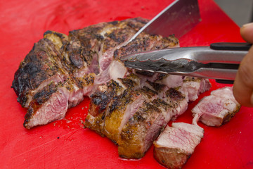 grilled steak cut with knife