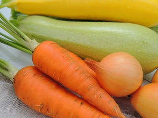 Organic fresh vegetables, ingredients for preparing food on linen tablecloth background.