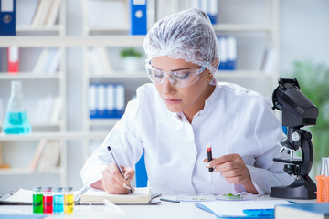 Female scientist researcher conducting an experiment in a labora