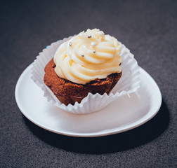 Chocolate caramel cupcake with nuts and butterscotch syrup