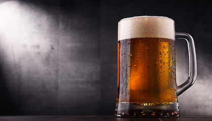 Composition with glass of beer