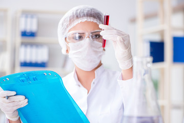 Female scientist researcher conducting an experiment in a labora