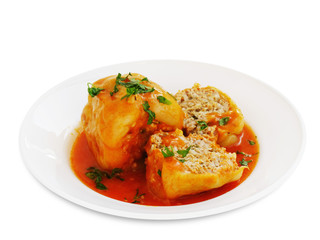 Stuffed peppers in tomato sauce isolated