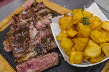 Grilled steak with fried potatoes