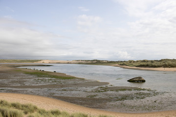 Shipwreck in shallow river estuary