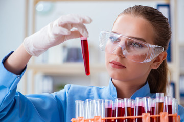 Female scientist researcher conducting an experiment in a labora