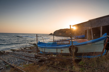 Wooden boat in a fishing village at sunrise