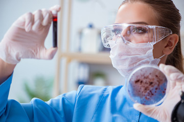 Female scientist researcher conducting an experiment in a labora