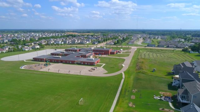 Stock Aerial Video Residential Neighborhood And A School