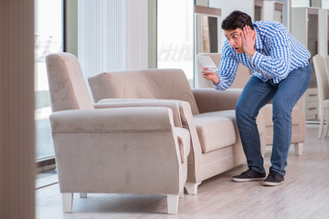 Fototapeta premium Young man shopping in furniture store