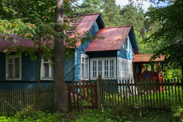 A typical residential wooden house in settlement in Leningrad region, Russia.