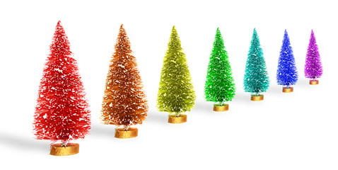 Raibnow clored small artificial Christmas trees over white background
