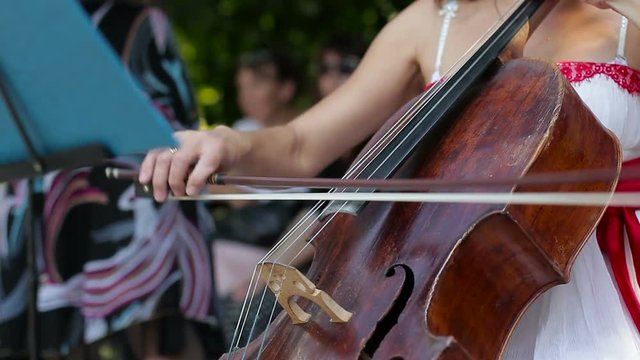 Woman playing the cello on the street
