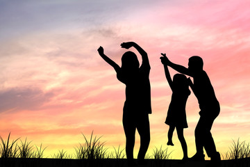 silhouette of family, mom and dad, parents take daughter or girl dancing in sunset  because They have free time,  relax and have funny and happy day.