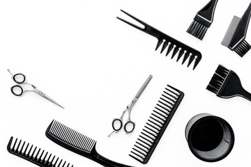 hairdresser work desk with tools for hair styling on white background top view space for text