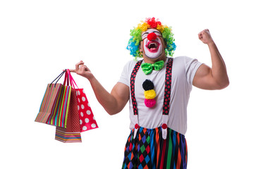 Funny clown after shopping bags isolated on white background