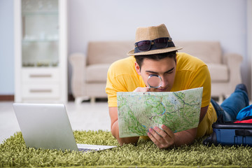 Man planning his vacation trip with map