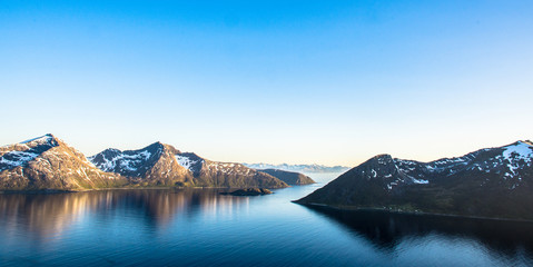 Fjord mountain midnight sun two peaks