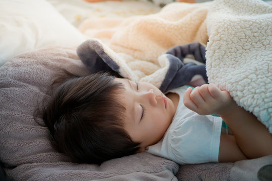 Asian Child Sleeping On Bed / Feeling Sick