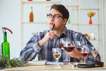 Professional sommelier tasting red wine 