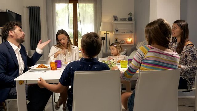 Parents At The Table With Family Fighting Strong About Education Of Children