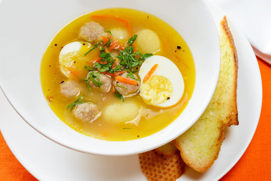 Soup with eggs and meatballs