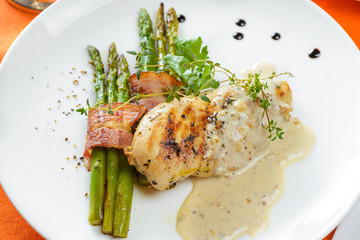 Chicken fillet with asparagus and sauce