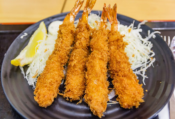 Japanese deep fried shrimp or tonkatsu set with rice on wooden table
