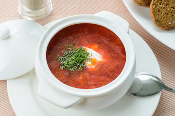 Borscht with sour cream in pot
