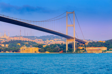 bridge through the Bosphorus strait in the evening on a sunset