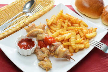 Chicken kebab with French fries