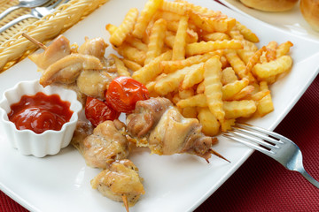 Chicken kebab with French fries