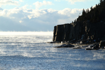 Otter Point in sea smoke-winter Acadia